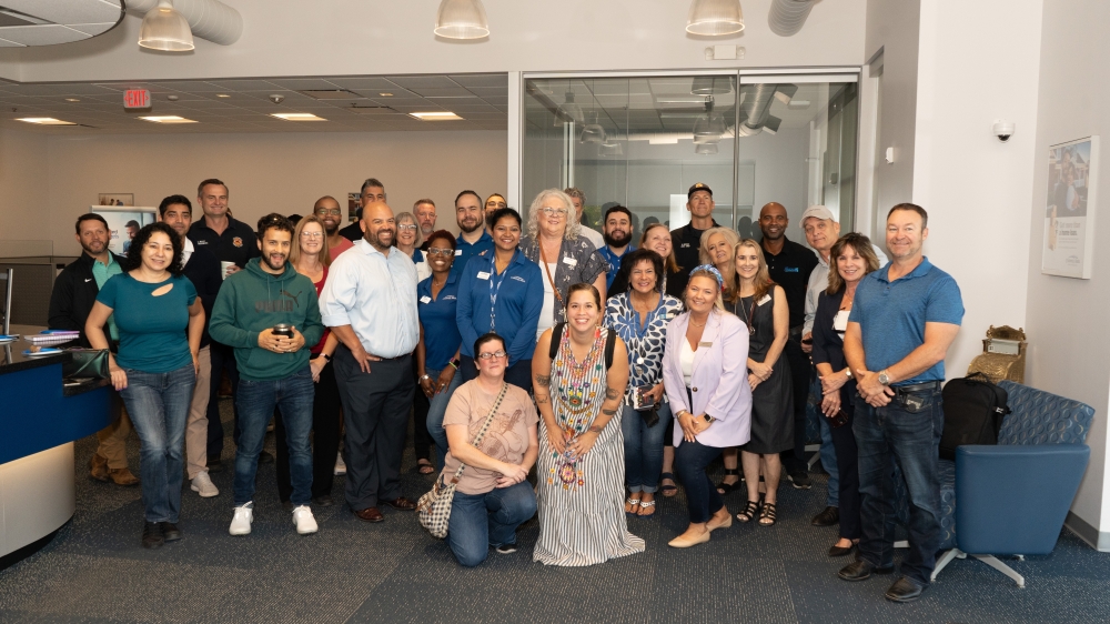 Business people gather for group photo