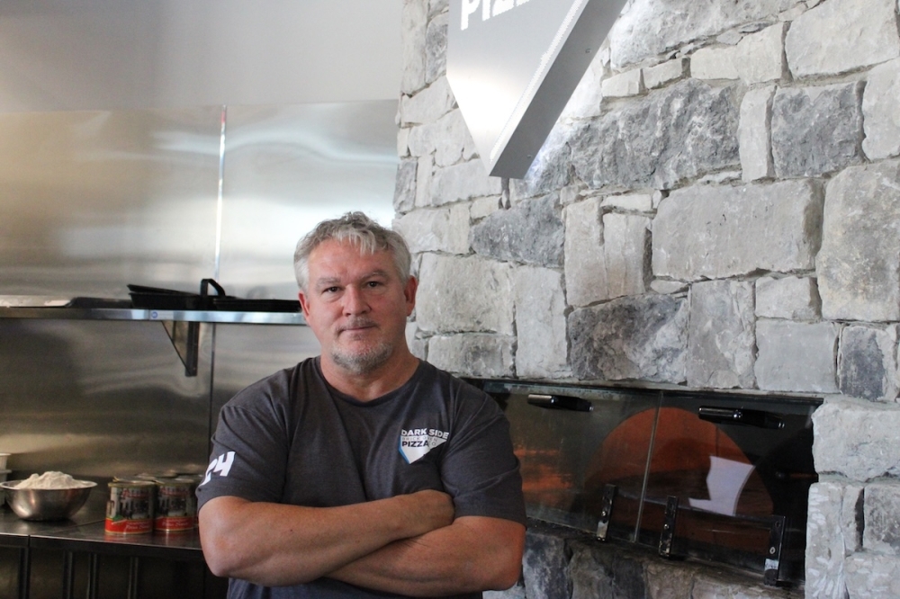 Michael Hawes, a longtime toy collector and 1980s fanatic, opened Darkside Brick Oven Pizza Co. in May 2024. (Andrew Creelman/Community Impact)