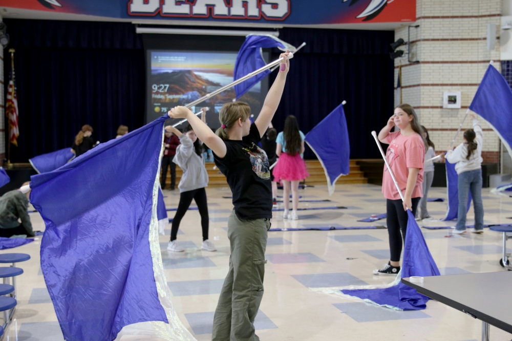 Magnolia ISD color guard students dance