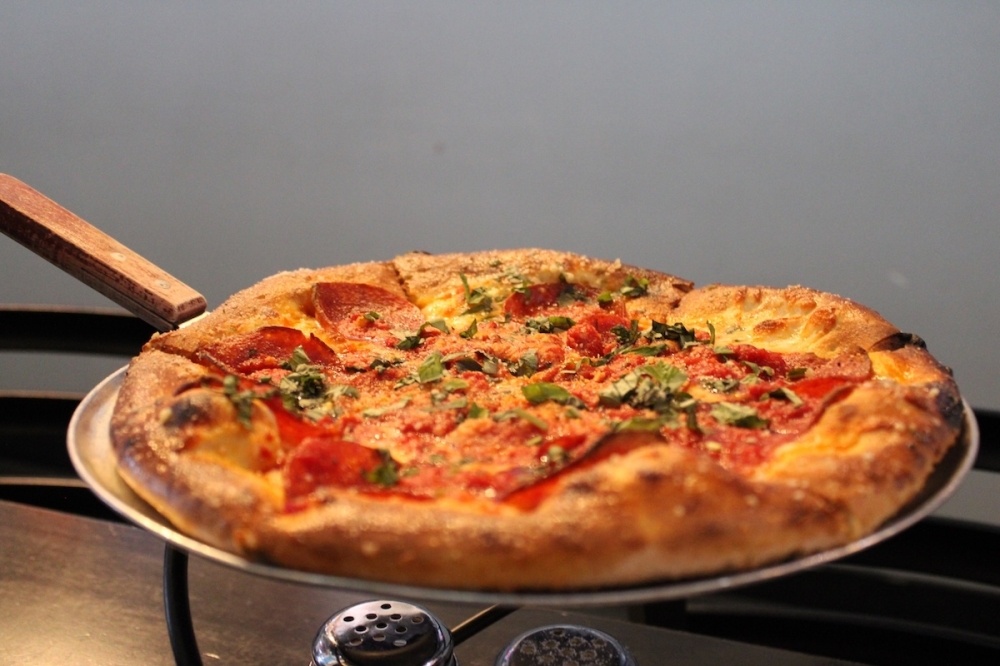 Customers can choose from a variety of 12 or 18 inch oven fired pizzas at Darkside. (Andrew Creelman/Community Impact)