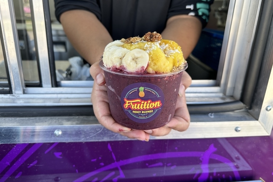 The Brazilian bowl ($11.99) at Fruition Fruit Blendz has an acai base topped with blueberry flax granola, raw honey and more. (Thalia Guzman/Community Impact)