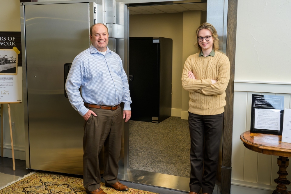 Bankers standing by elevator in best bank in Hutto