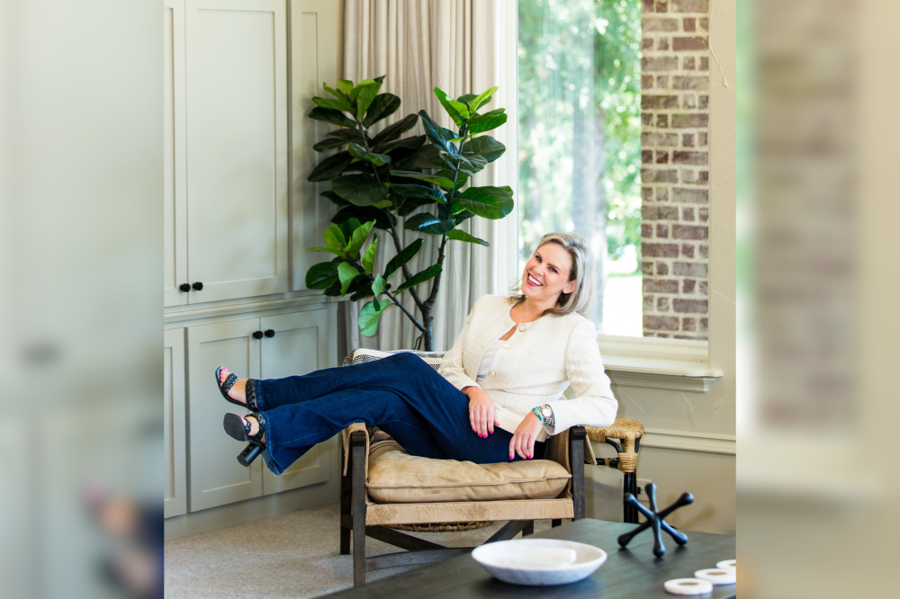 Realtor in Dallas posing on couch
