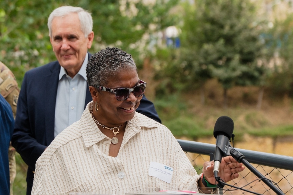 Waterloo Greenway CEO Colette Pierce Burnette celebrated the completion of the biofiltration pond downtown on Oct. 24. She was joined by city officials, the U.S. Army Corps of Engineers and U.S. Rep. Lloyd Doggett. (Courtesy Waterloo Greenway)