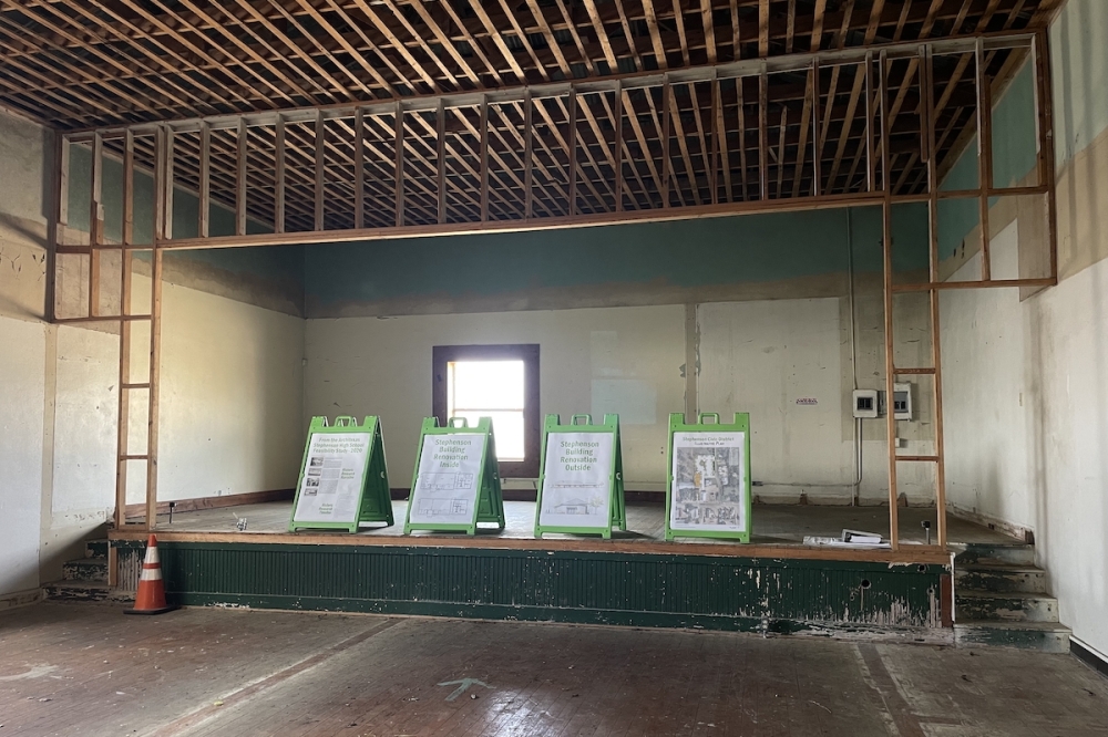 The back wall (pictured) will be taken down to expand the building. Behind the renovations is QA Construction. (Sienna Wight/Community Impact)