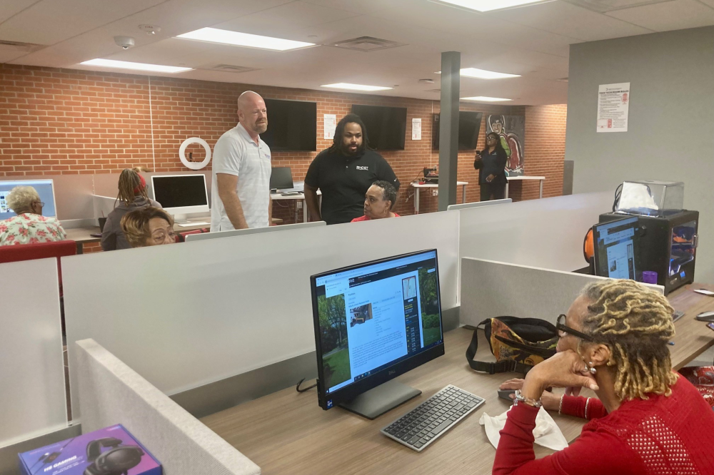 Person sitting at computer learning about cybersecurity tips