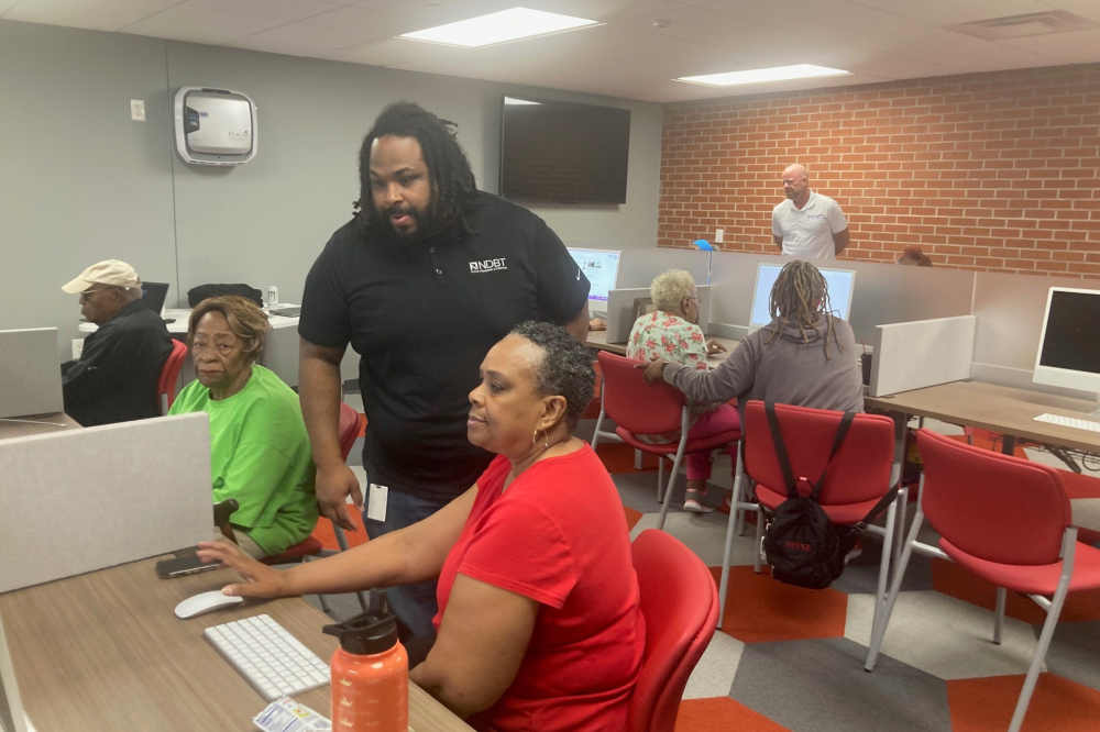Banker teaching class about password hygiene
