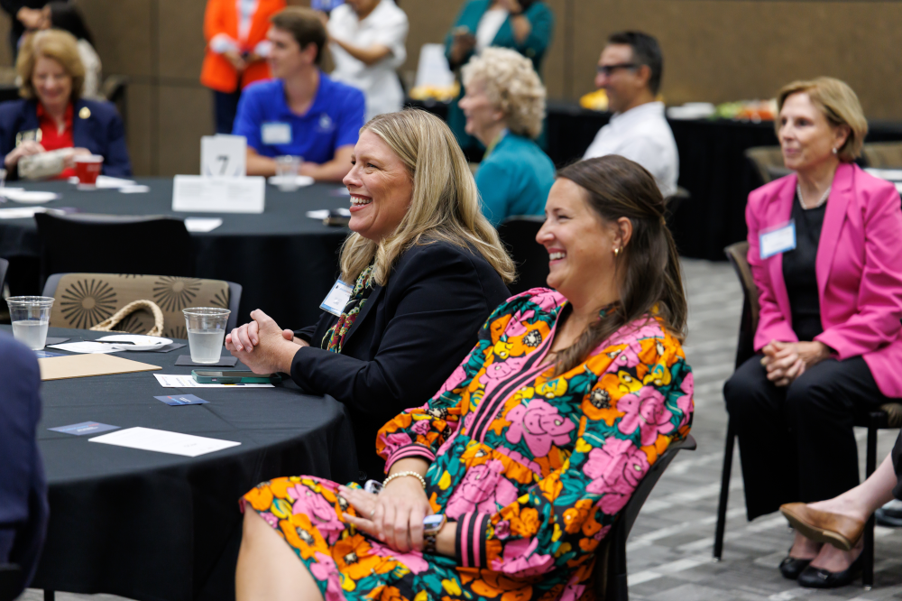 Women laugh at Collin County event