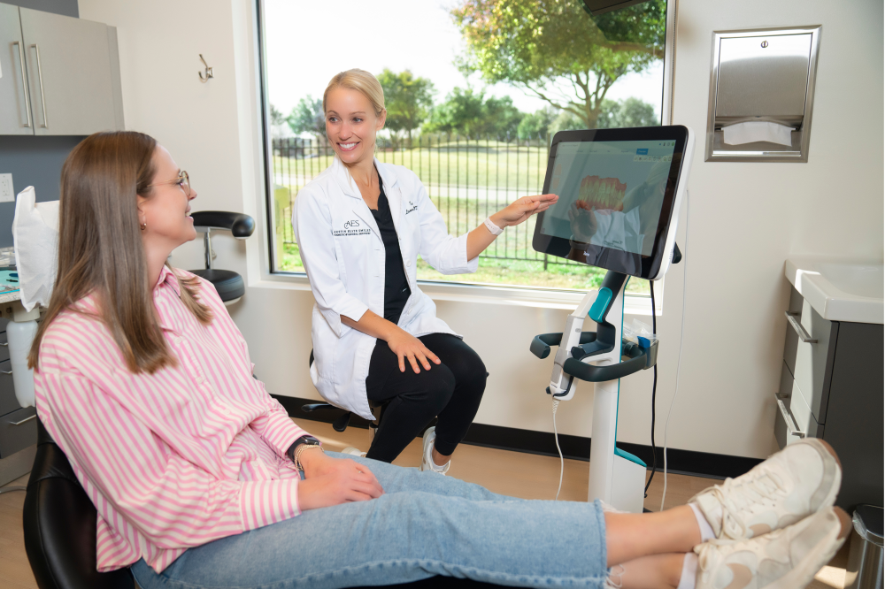 Best dentist in Austin talks to patient