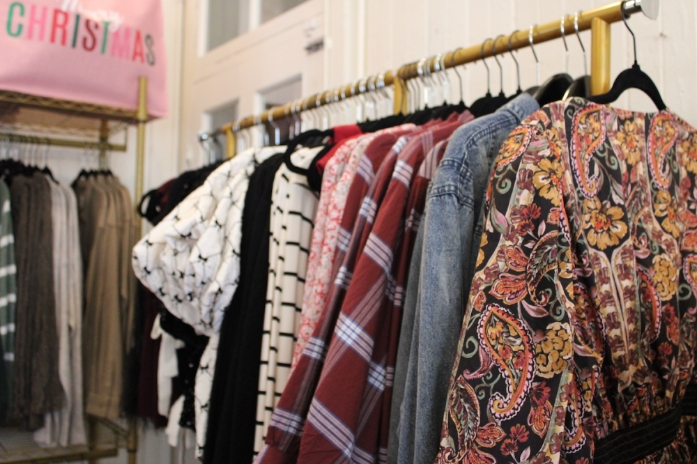 Aside from holiday gifts, the pop-up shop also has a selection of themed clothing and accessories. (Andrew Creelman/Community Impact)