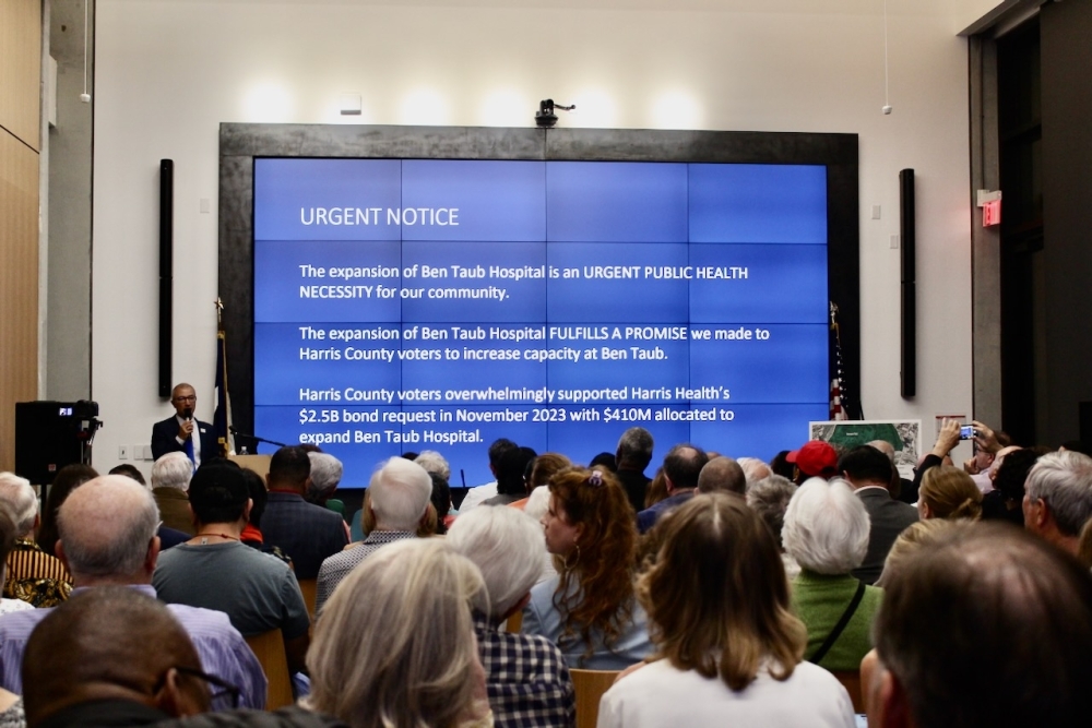 Harris Health CEO Esmaeil Porsa speaks with a full house crowd at the Harris County Precinct 1 town hall on Nov. 12. (Melissa Enaje/Community Impact)