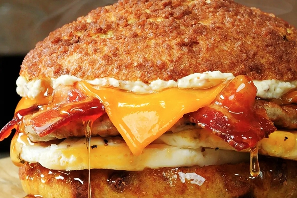 Einstein Bros. Bagels' Maplehouse Egg Sandwich features cage-free eggs with pork sausage, bacon and cheddar cheese on a bagel. (Courtesy Einstein Bros. Bagels) 