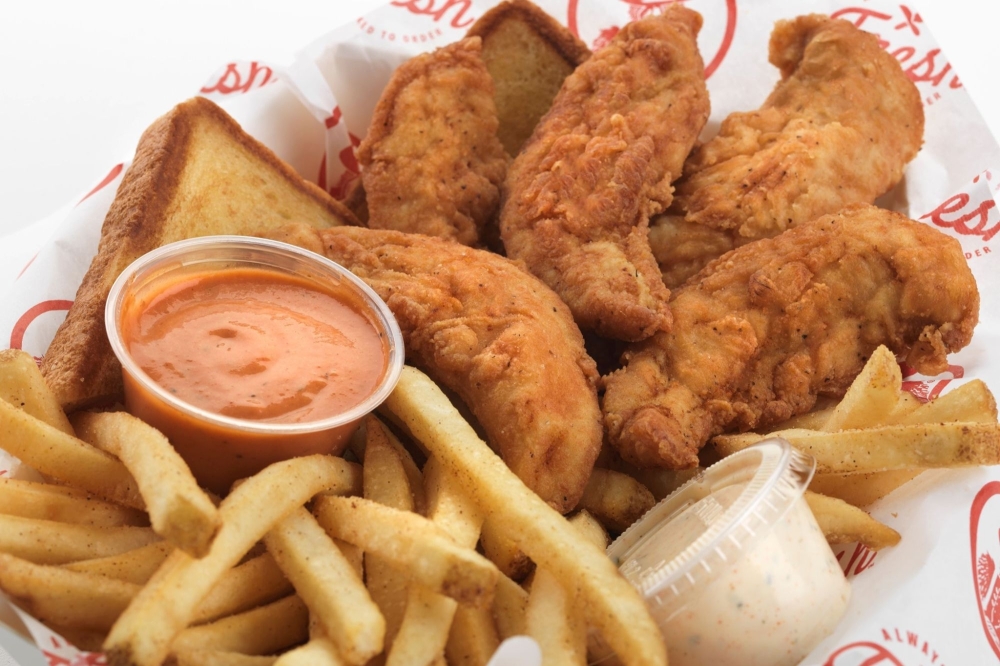 Five hand-breaded tenders, two sauces, toast and fries make up the Slim Chickens Original. (Courtesy Slim Chickens)