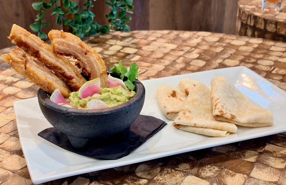 The Pork Belly Cracklings ($12) is citrus-marinated, crispy pork belly served with guacamole, radish and corn tortillas. (Courtesy The Courthouse)