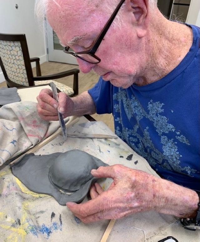 An ArtReach participant crafts with clay. (Courtesy Cafe Monet)