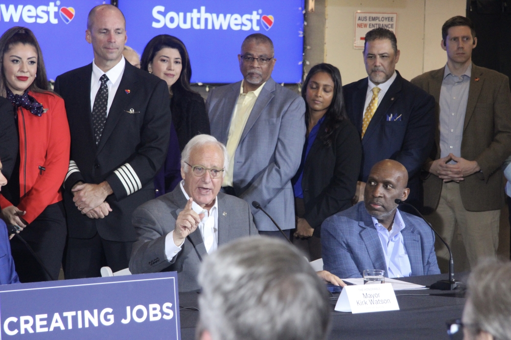 Mayor Kirk Watson, left, spoke about the impacts of Southwest's expansion at the Austin airport. (Ben Thompson/Community Impact)