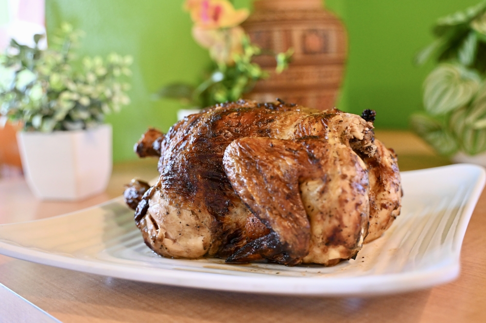 The chicken at Las Brasas is marinated for 24 hours before being slow-cooked in a rotisserie charcoal grill. (Roo Moody/Community Impact)