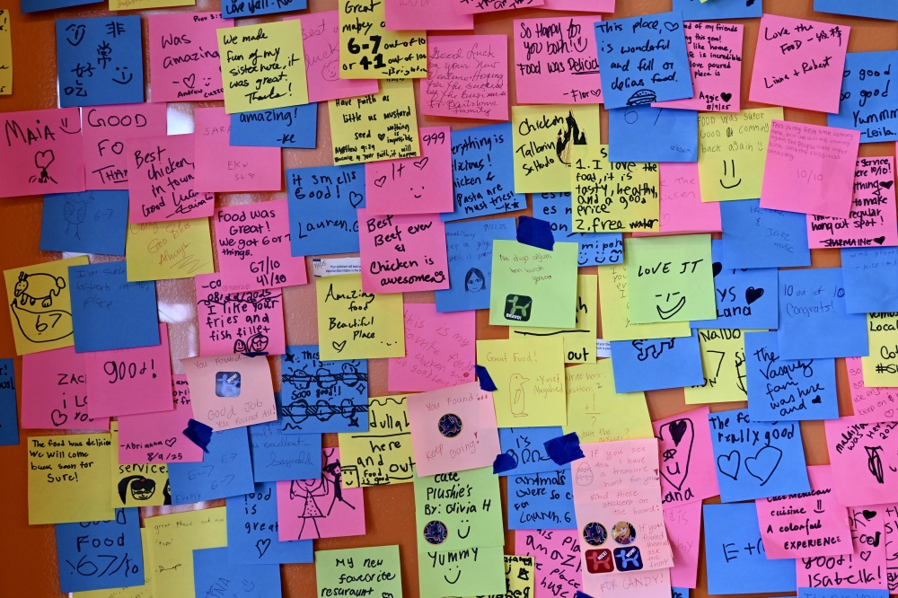 Ash Shiao set up a sticky note wall, where customers can leave notes and feedback. (Roo Moody/Community Impact)