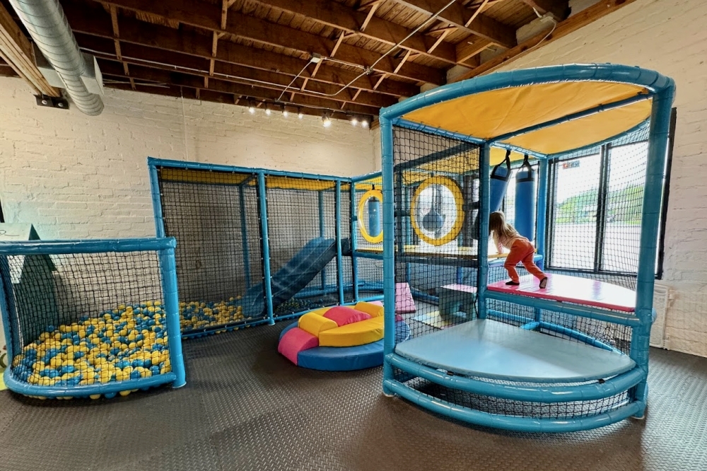 The cafe offers a coffee counter and reservable playground, as well as party packages for birthdays and children's events. (Courtesy Tot Box Play Cafe)