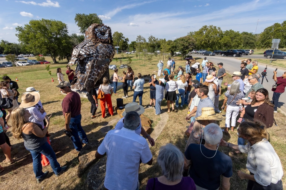 Local officials, business owners and residents celebrate Bastrop’s latest art installation. (Courtesy city of Bastrop)