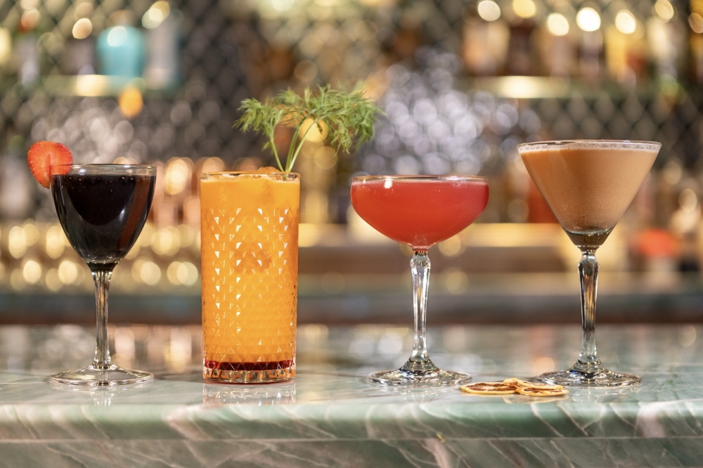 The bar's mocktail lineup features drinks titled Obsidian, Golden Hour, Elder Red and Nightcap. (Courtesy Good God, Nadine's)