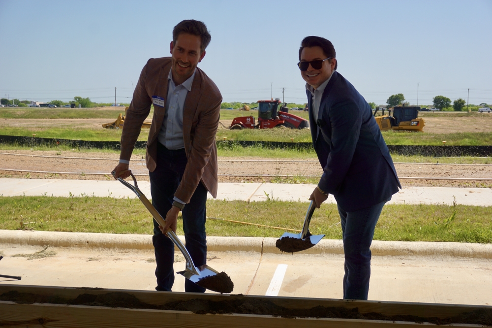 Spencer Harkness (left), and Mason Mote, both co-founders and managing principals at Pearl River Companies, at the Sendero groundbreaking April 10. (Sierra Martin/Community Impact)