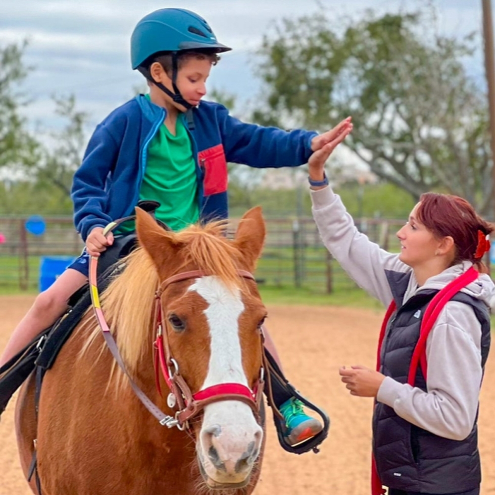 Open My World Therapeutic Riding Center offers equine-assisted therapy for both adults and children. (Courtesy Open My World Therapeutic Riding Center)