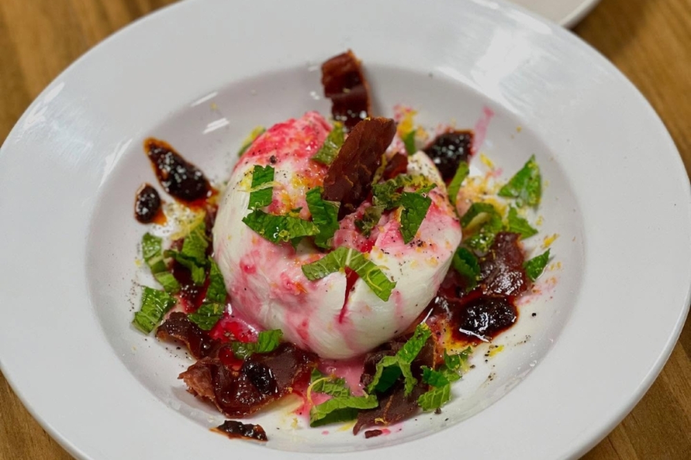Fresh Burrata with jamon and prickly pear gastrique ($22) complements the tapas menu at Favorite Neighbor. (Courtesy Favorite Neighbor)