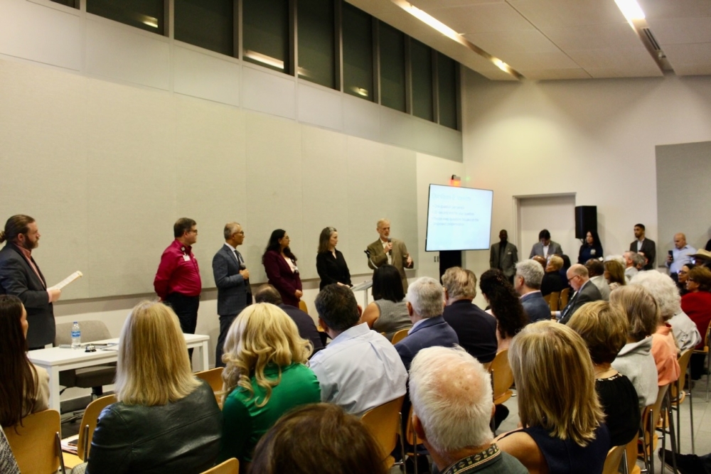 Both Harris Health and Hermann Park Conservancy officials and legal team members spoke to audience members who spoke during the question and answer section of the town hall on Jan. 7. (Melissa Enaje/Community Impact)