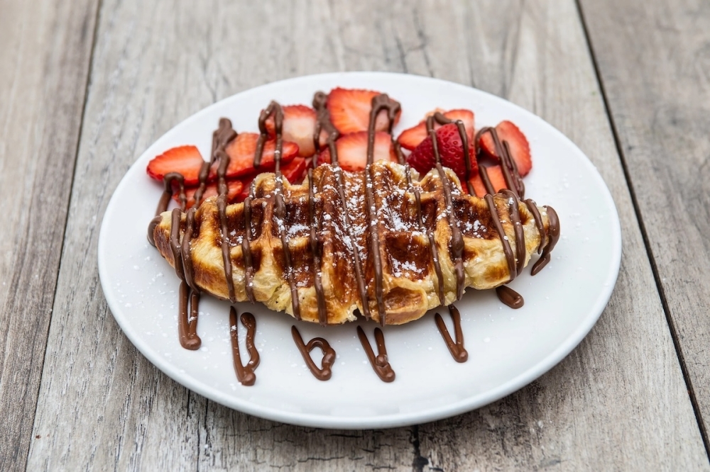 The Nutella Strawberry Croffle ($5.80) is a cross between a waffle and a crepe, topped with strawberries, powdered sugar and Nutella drizzle. (Courtesy Crepeccino)