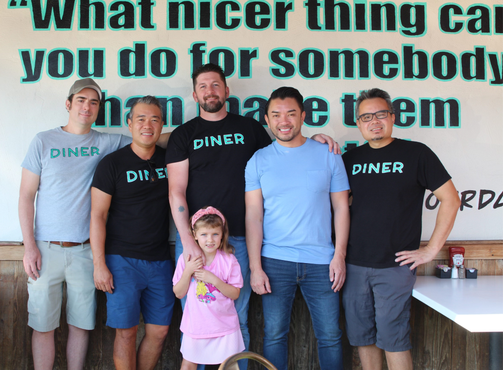 The owners of Phoebe's Diner pose together, along with the restaurant's namesake. (Courtesy Sara Lauren Hinojosa/Phoebe's Diner)