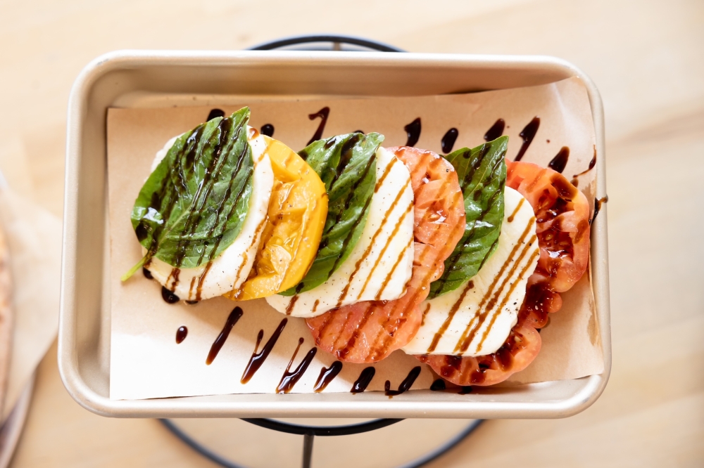 Winston's: Coffee, Provisions & Pizza serves wood-fired pizza available in various flavors. (Courtesy Winston’s: Coffee, Provisions & Pizza)